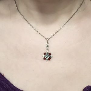 Sterling silver pendant with garnet stones